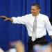 President Obama smiles as he greets supporters while making his way to the stage for a speech at the Al Glick Fieldhouse on Friday morning.  Melanie Maxwell I AnnArbor.com